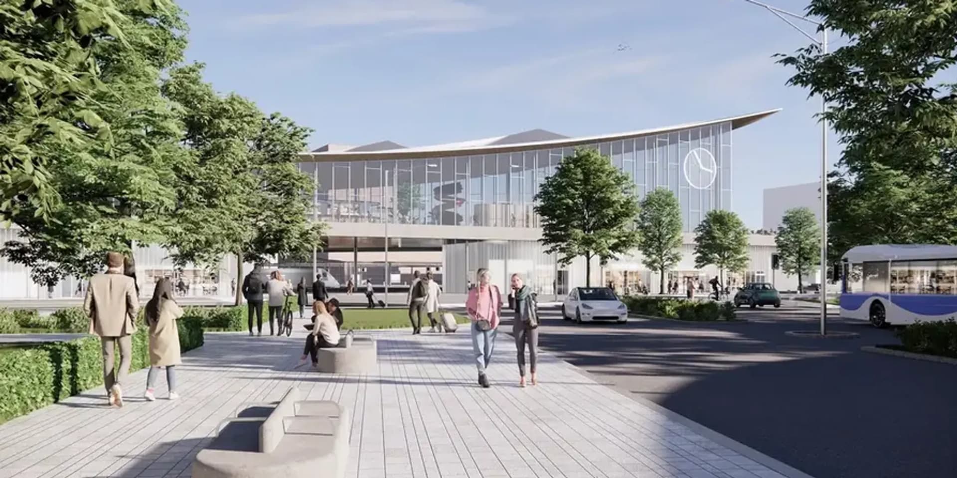 En grupp människor som går längs en trottoar intill en byggnad.