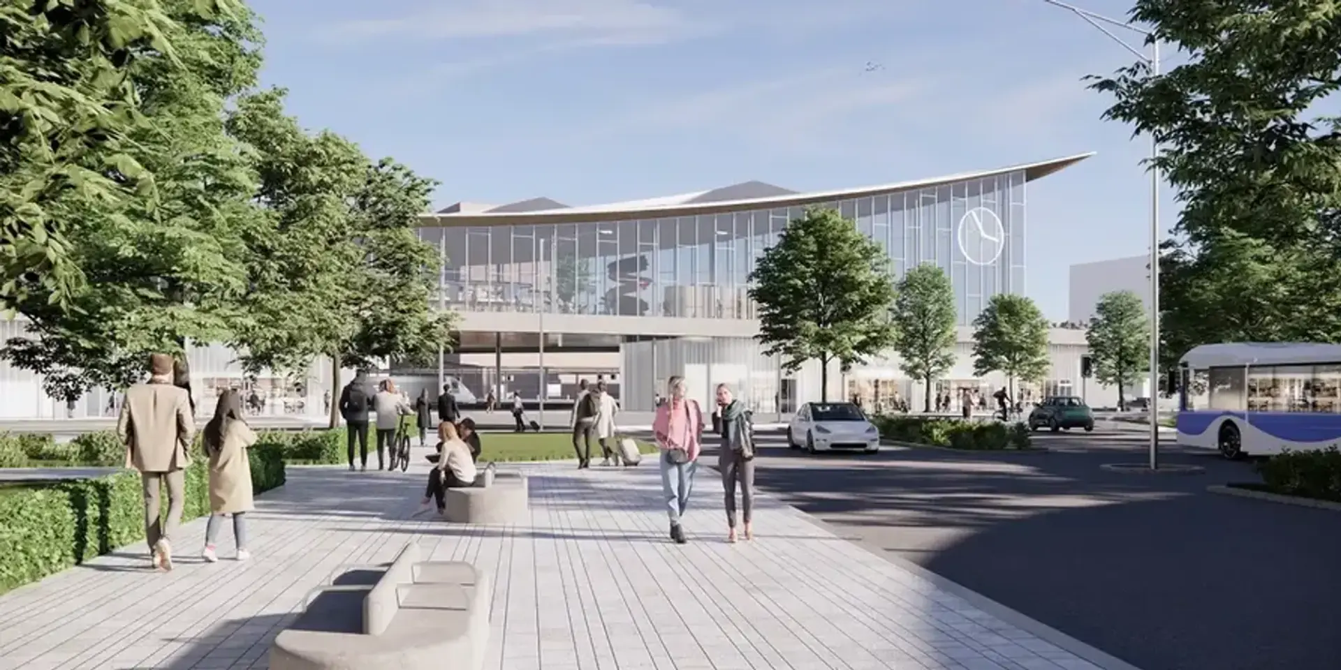 En grupp människor som går längs en trottoar intill en byggnad.